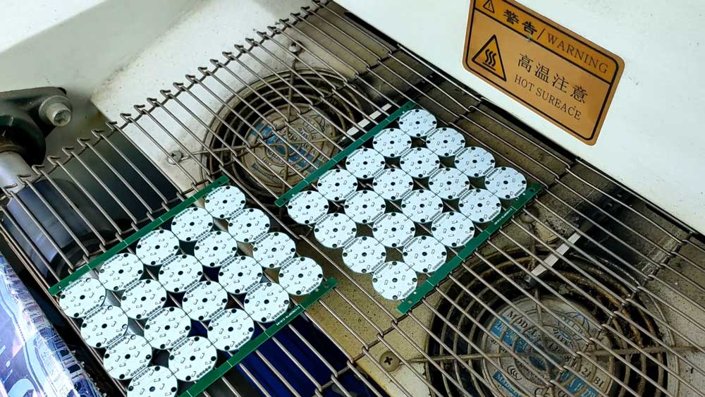 pcb passing through hot oven.jpg
