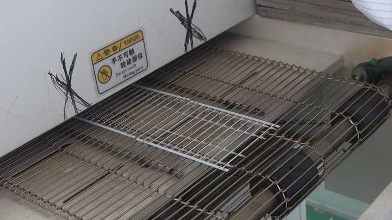 pcb passing through hot oven.jpg