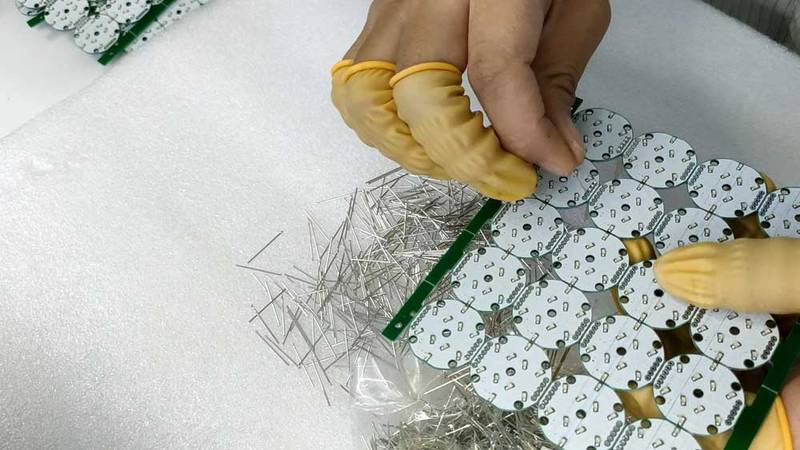 insert metal pins into pcb by hand.jpg