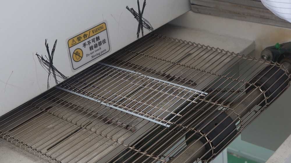 pcb passing through hot oven.jpg