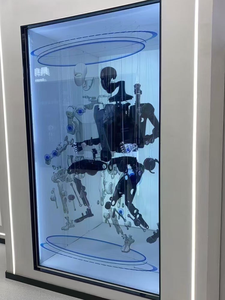 a robotic figure displayed in a transparent lcd showcase