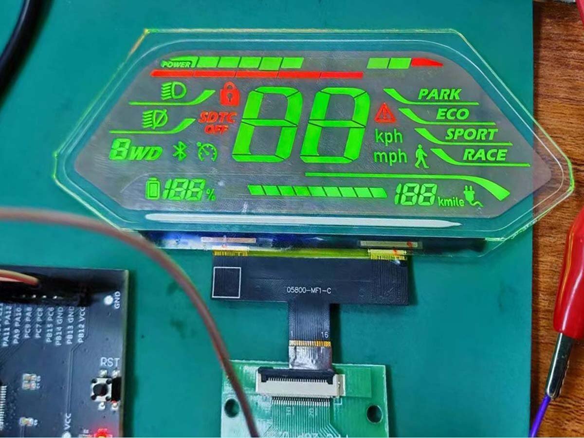 small sized transparent oled display for vehicle emits a bright green glow