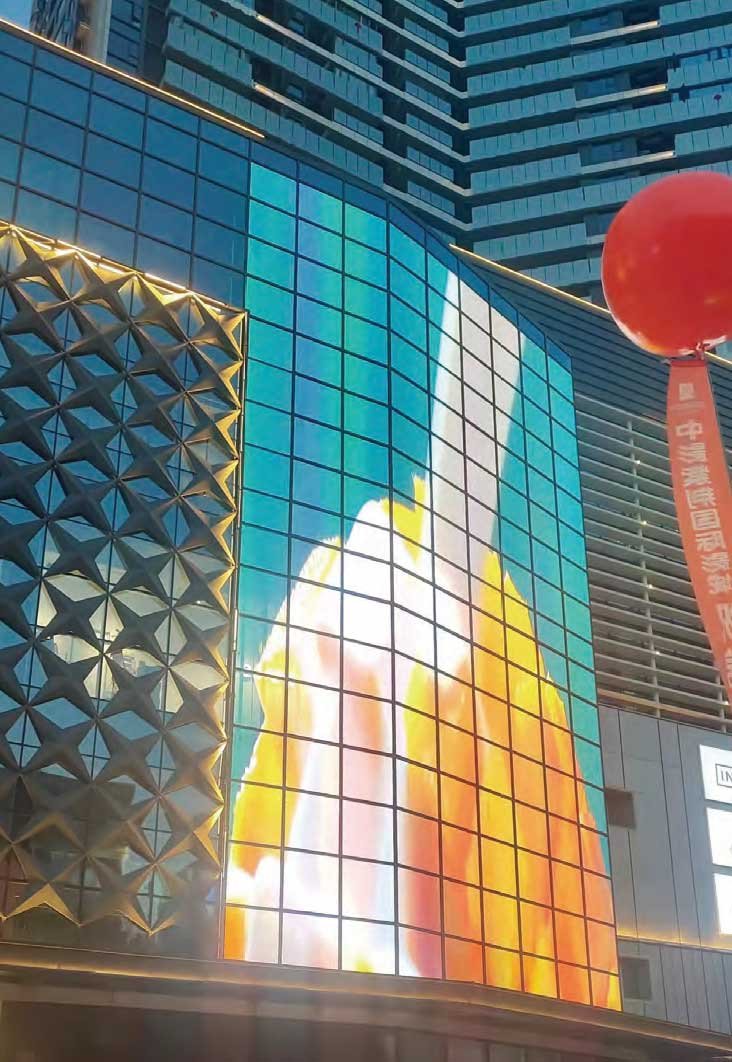 transparent led display integrated seamlessly into a curved glass facade