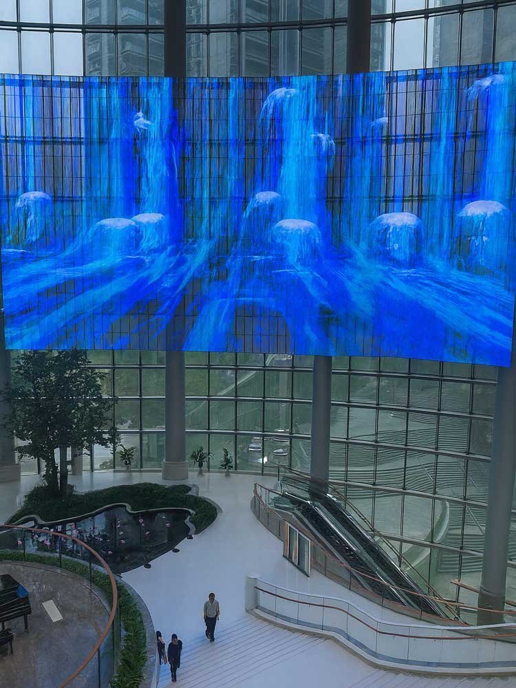immersive waterfall display — indoor transparent led screen in atrium